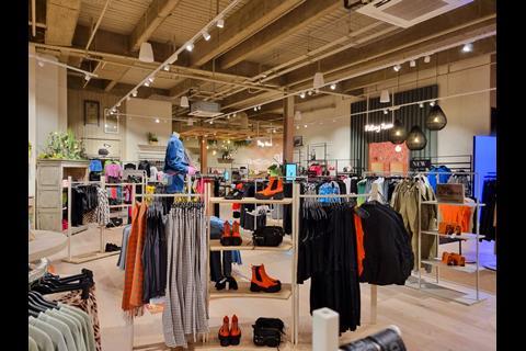 Interior of River Island's River Studios store in Derby, showing racks of womenswear